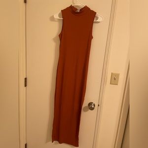 Rue 21 bodycon dress. Size small. Burnt orange color with slit by leg.